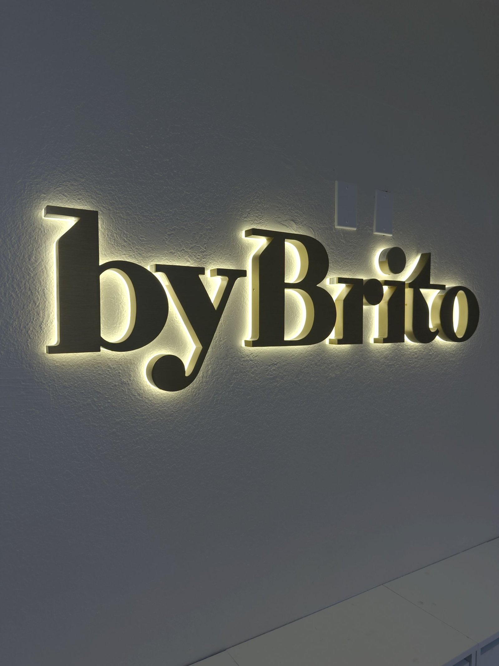 Halo-lit gold lettering for byBrito