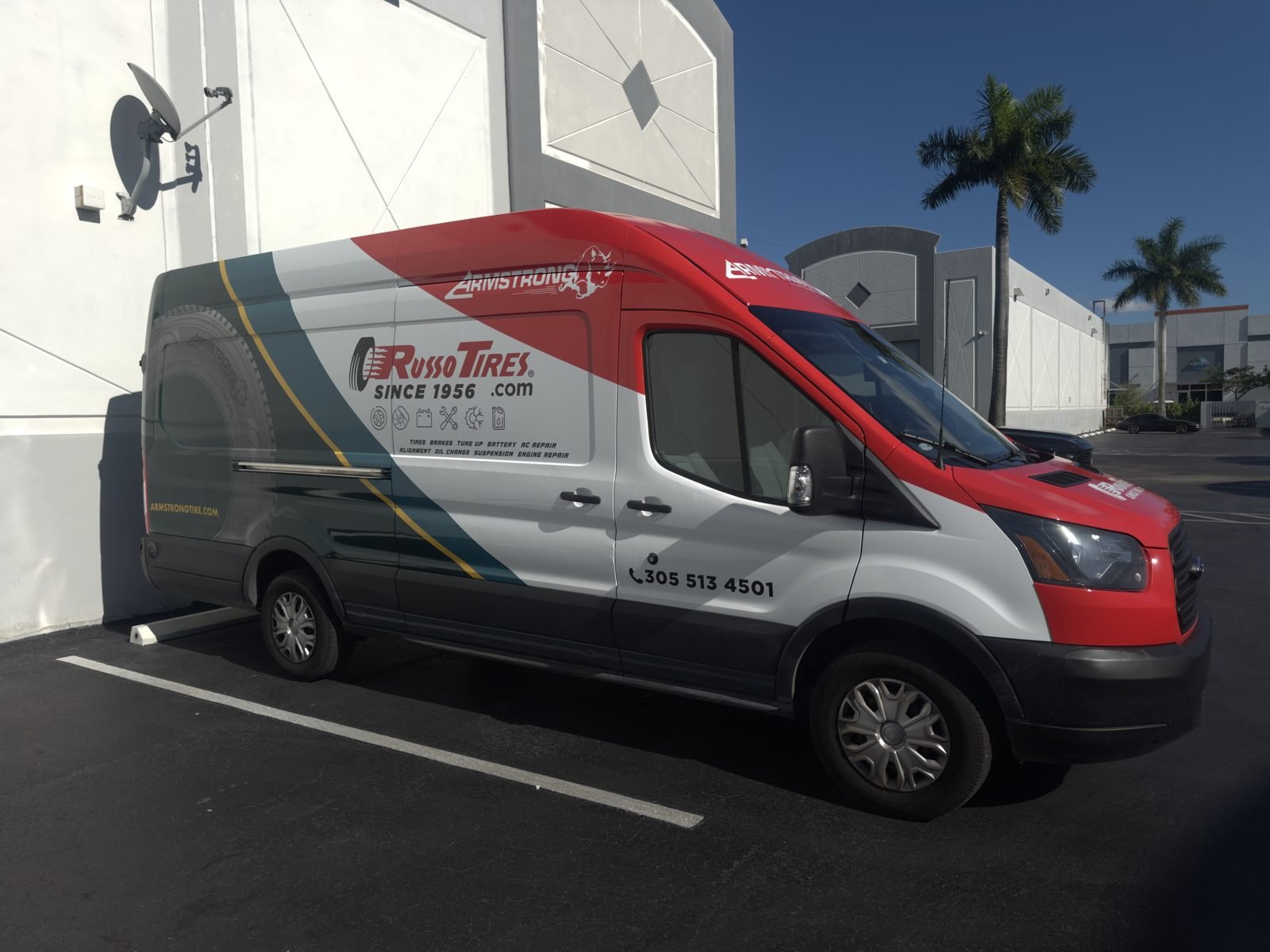 White and red cargo van wrap for a Miami tire shop