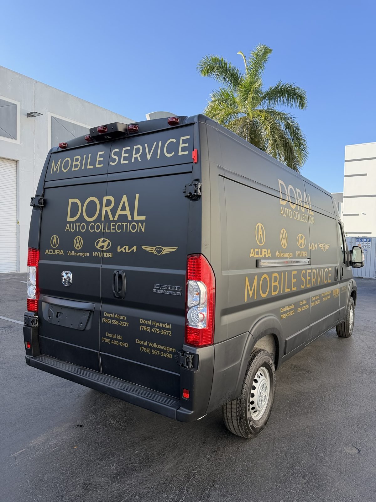 Doral Auto Collection mobile service van with gold fleet graphics