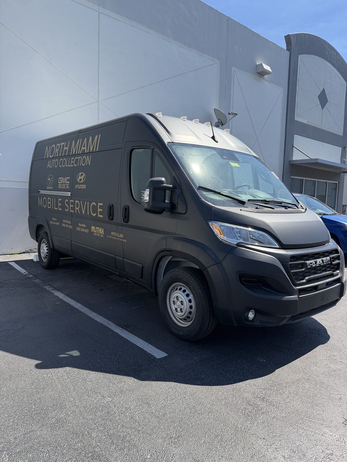 North Miami Auto Collection mobile service van with gold vinyl graphics