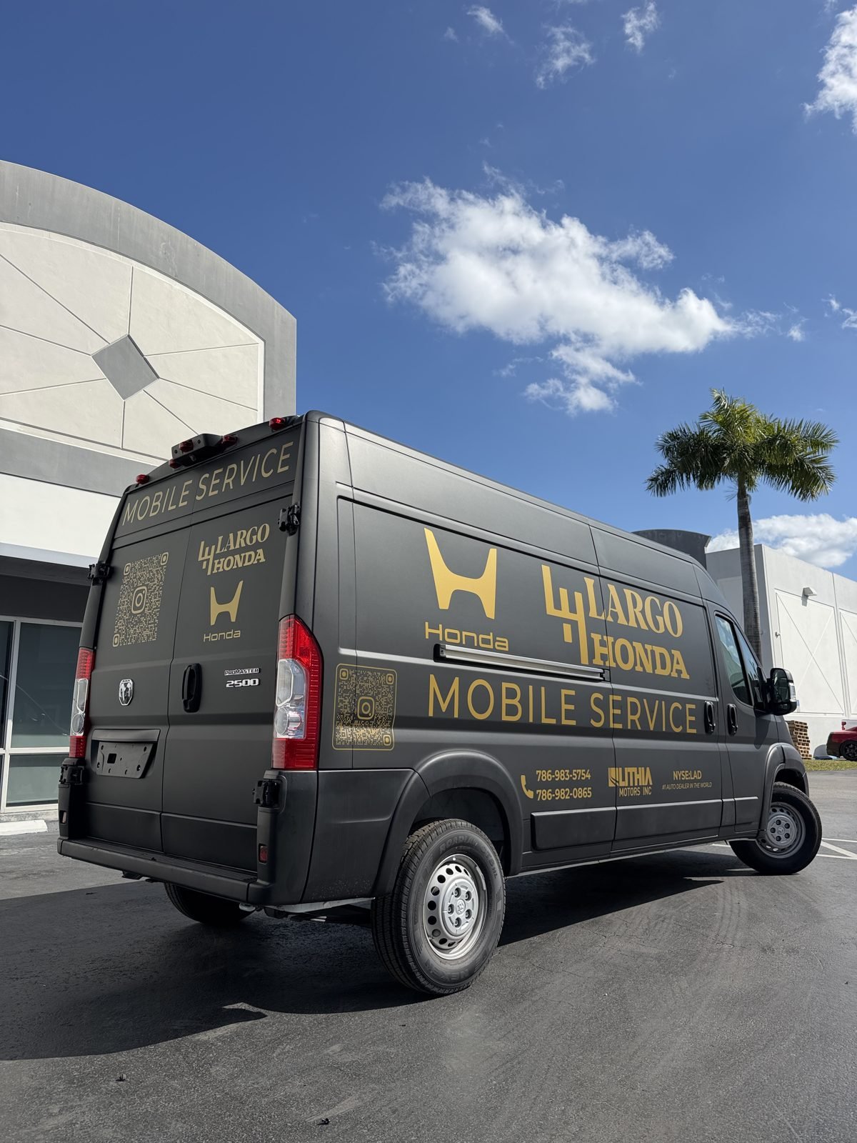 Largo Honda mobile service van wrapped in matte black with gold graphics
