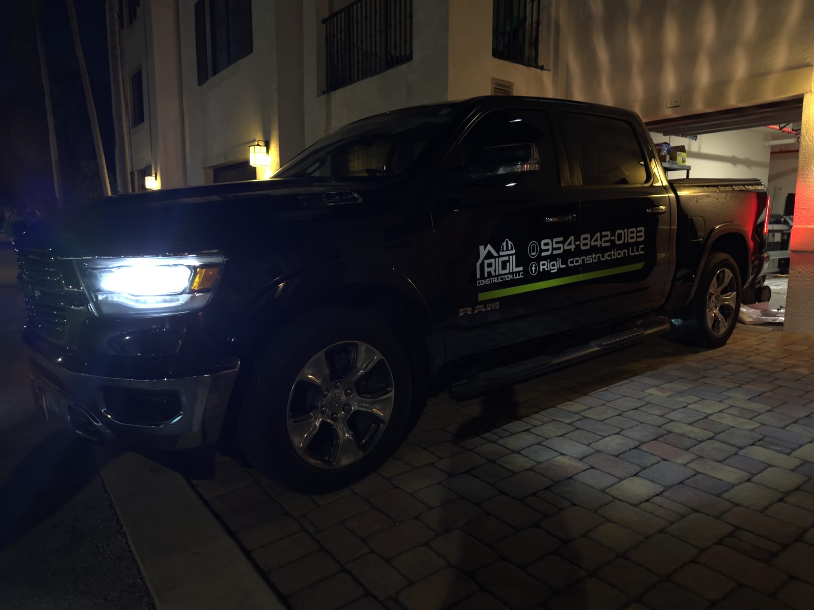 Black pickup truck with door graphics